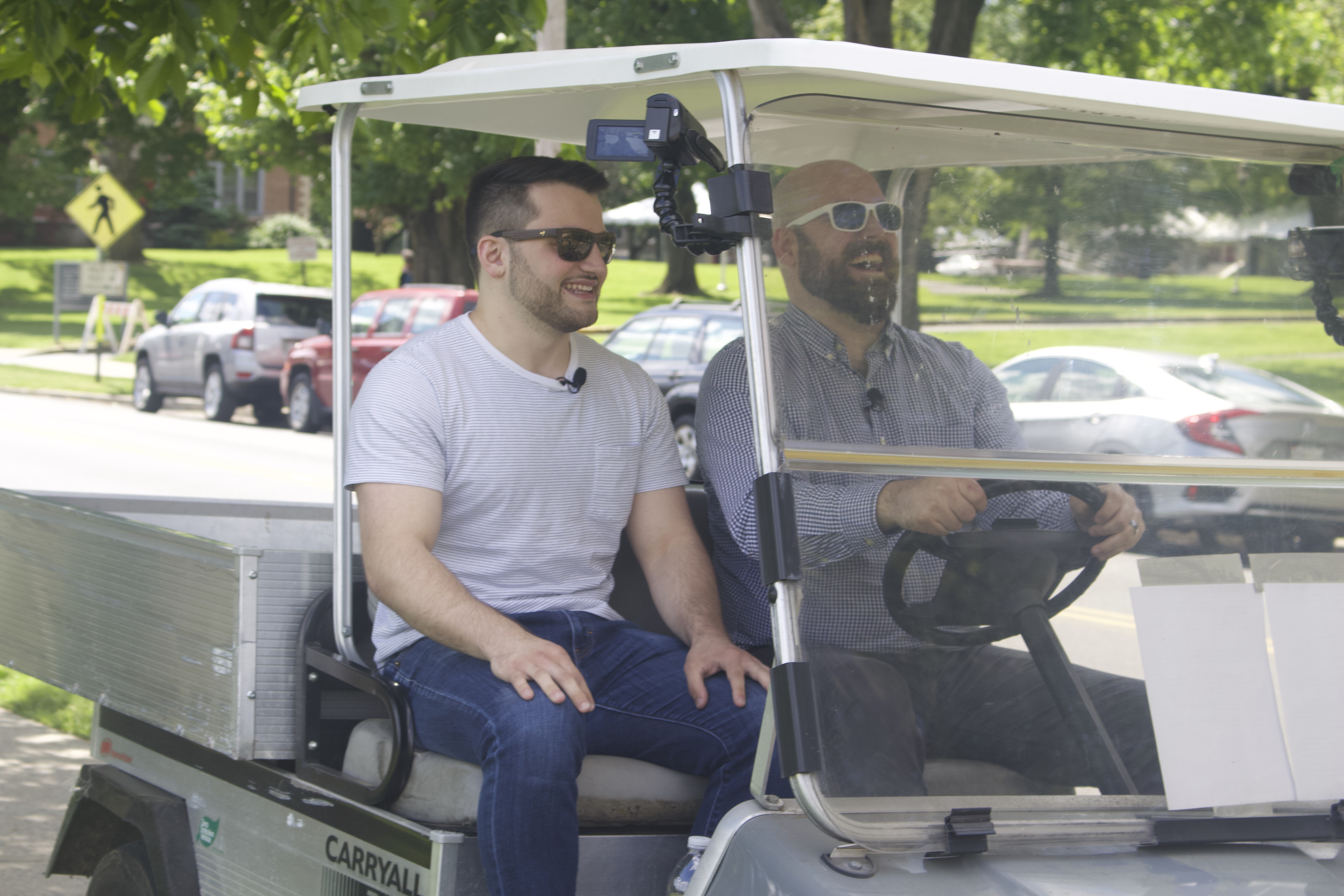 Image for Anthony and Tony talk and travel around campus in a golf cart in this image from the filming of episode 2.